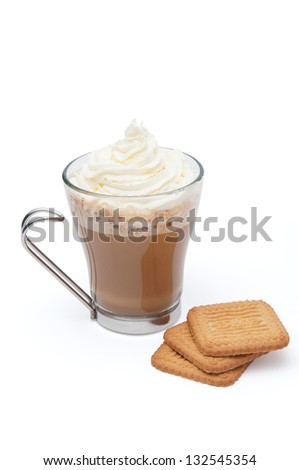 A cappuccino in a transparent Cup with cream and cookies on a white background