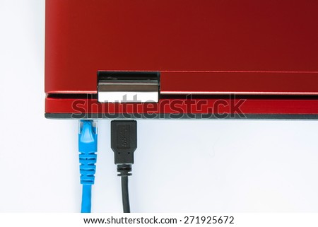 USB cable and Lan cable are connecting to laptop computer