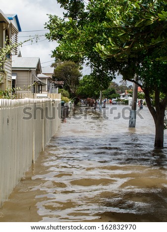 BRISBANE, QLD, AUSTRALIA - January 27: Flood in Sandgate in Brisbane, with flood waters covering all the road and pavement on 27 January 2013