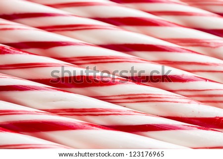 Macro pattern of multiple red and white peppermint candy canes