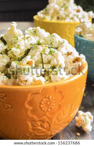 Popcorn sprinkled with furikake, a japanese seasoning made of sesame seeds, salt, sugar and seaweed, common in Hawaii