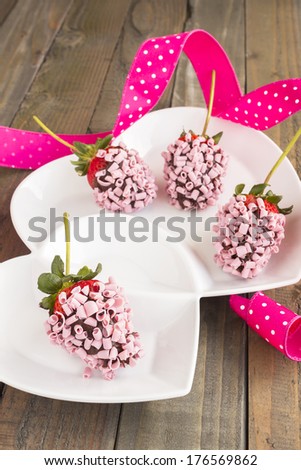 Strawberries dipped in chocolate and covered with pink chocolate curls
