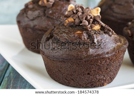 Chocolate muffins filled with peanut butter chips and mini chocolate chips