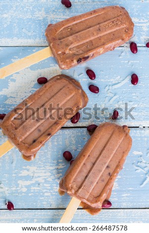 Hawaiian ice pops made with shaved coconut and sweetened adzuki beans