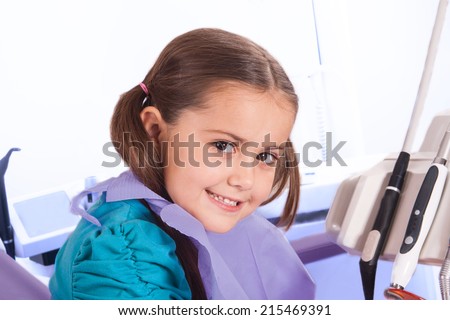 pretty little girl in dental office waiting for the doctor