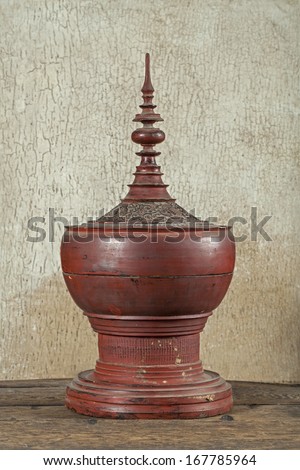 Antique red lacquer wares in wooden crack background (Still life)