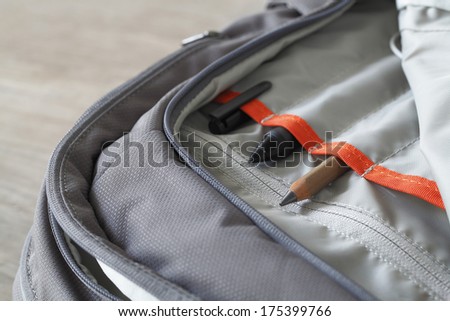 Pen and pencil in canvas laptop backpack