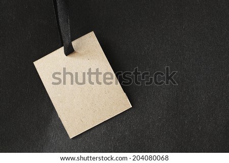 Paper tag on black paper