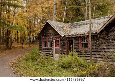 Scenic view of an abandoned cottage during Fall peak foliage season in New England. The building is located in the proximity of Route 20, 1 mile West from Chester, MA, USA