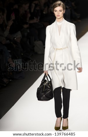 NEW YORK - FEBRUARY 13: A model is walking the runaway at J. Mendel Show for Fall/Winter 2013 Collection during Mercedes-Benz Fashion Week on February 13, 2013 in New York