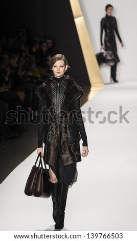 NEW YORK - FEBRUARY 13: A model is walking the runaway at J. Mendel Show for Fall/Winter 2013 Collection during Mercedes-Benz Fashion Week on February 13, 2013 in New York