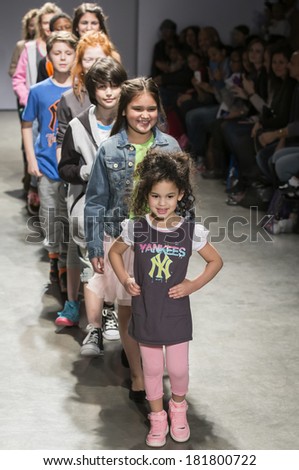 NEW YORK - MARCH 08 2014: Models walk the runway at CCandy Clothing 2014 Fall Collection Show during petitePARADE Kids Fashion Week