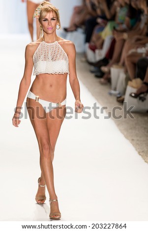 MIAMI - JULY 20: A model is walking the runway at Nicolita for the Spring/Summer 2014 collection during Mercedes-Benz Fashion Week Swim on July 20, 2013 in Miami.