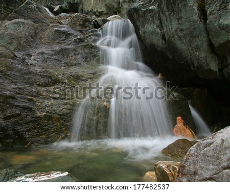 amazing waterfall landscape in Eastern Sayan mountains in summer