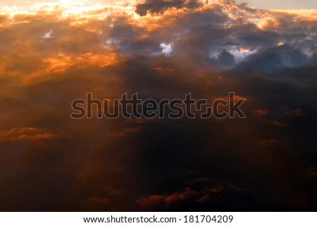 beautiful clouds colored glow of the setting sun on the sky background