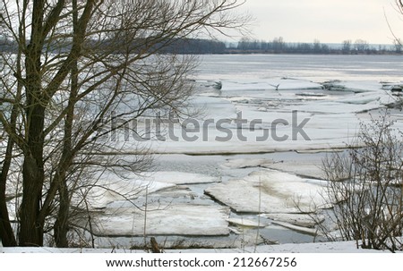 landscape ice drift on the river in early spring on a cloudy day