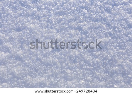 macro texture of pure snow in the sunshine