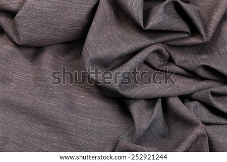 macro texture brown cloth in a circular fold
