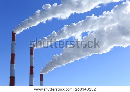 winter landscape smoke from the chimneys Zainsk TPP against the blue sky frosty misty morning