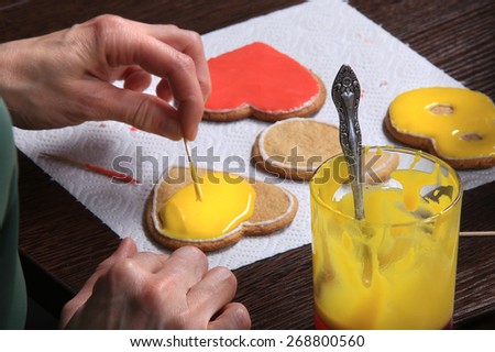 close-up of the process of hand-painted ginger cookies