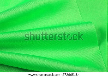 macro texture of the folds fabric green chiffon studio
