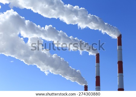 winter landscape smoke from the chimneys Zainsk TPP against the blue sky frosty misty morning
