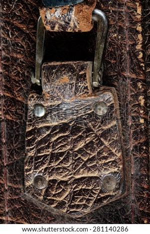 close-up fragment of locks and fasteners on the vintage leather suitcase brown