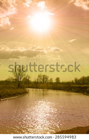 spring landscape calm river and trees on the banks of brightly colored sun instagram filter