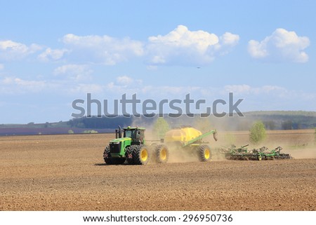 Naberezhnye Chelny, Russia - May 12, 2015: Planting in the field with the help of modern technology on a sunny spring day in May 2015