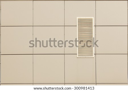 isolated close-up fragment modern industrial building facade  and ventilation grille