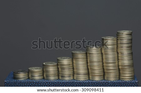 Macro silver coin stack isolated on a grey background Studio
