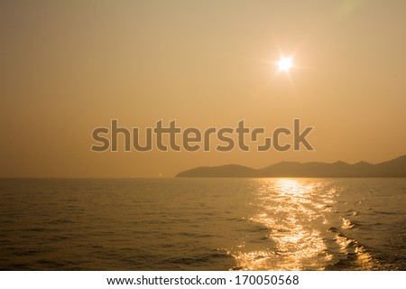The sun sets on the island