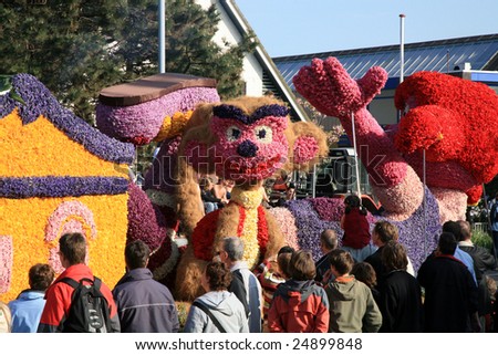 NETHERLANDS – CIRCA APRIL 2007: Spectators watch the Parade of Flowers called Bloemencorso which is held to celebrate the Day of Spring circa April 2007 in The Netherlands.