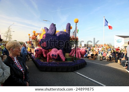 NETHERLANDS – CIRCA APRIL 2007: Spectators watch the Parade of Flowers called Bloemencorso which is held to celebrate the Day of Spring circa April 2007 in The Netherlands.