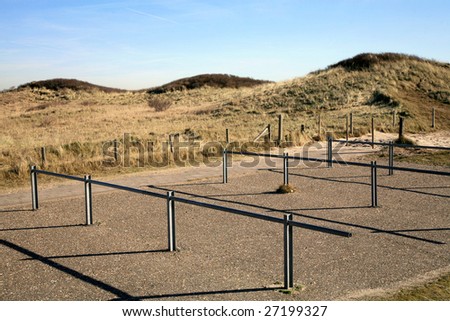 Place for bicycle\'s parking. Environmentally friendly mean of transport in reserve area near The Hague - Netherlands. Bicycle lane through seaside sand dunes.