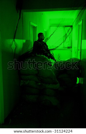 POLAND - MARCH 28 : View through the night vision device during a special military force training (battle camp) to conduct an attack inside a building at night March 28, 2008 in Poland.