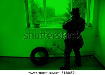 POLAND - MARCH 28: View through the night vision device during a soldiers training (battle camp) to conduct an attack inside a building at night March 28, 2008 in Poland.