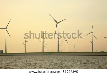 Wind turbine on the German island in the North Sea.  Early morning, sunrise.