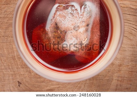 Overview of herbal tea in a cup with marsala tones