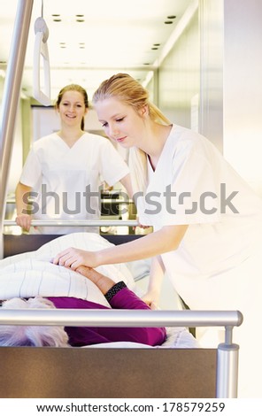 Bed and patient in the hospital with nurses