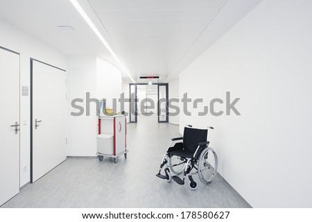 Wheelchair in the hallway with a door at the hospital