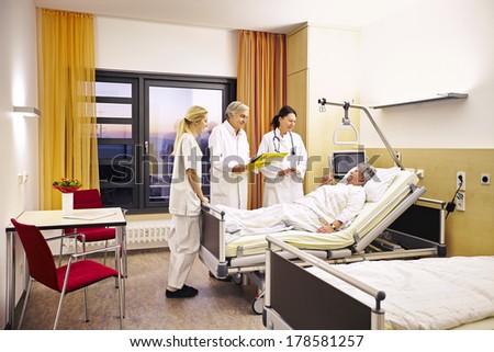 Hospital doctor's visit with sick patient