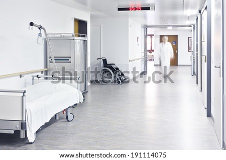 Hospital beds in the hall and doctor