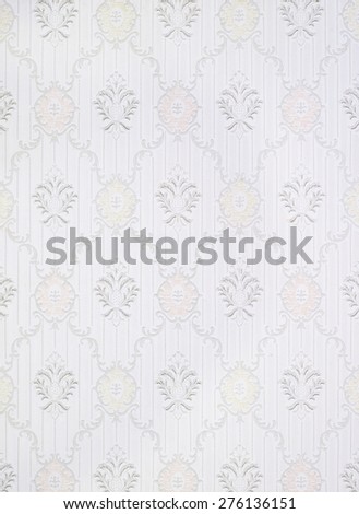 Old wallpaper with patterns in pastel colors