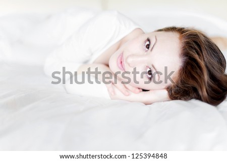 Attractive Asian Mixed Woman smiling sideways