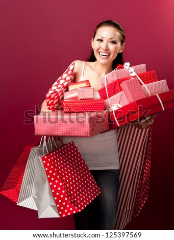 Attractive Asian Mixed Woman with gifts looking happy