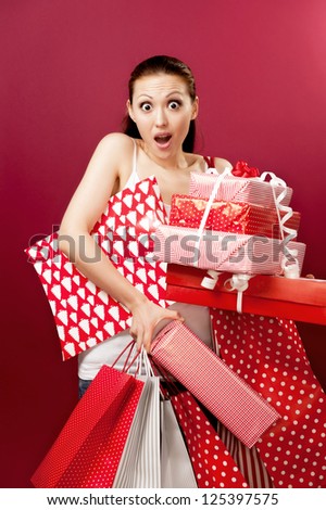 Attractive Asian Mixed Woman looking shocked with gifts