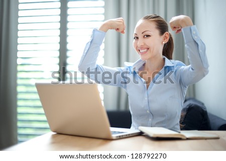 Attractive Mixed Business Woman happy showing strength
