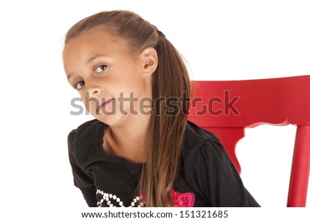 Young girl with brown hair glancing sideways