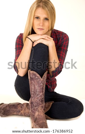 female model wearing cowboy boots sullen expression